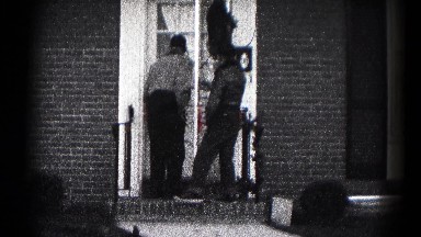 1959: two young men entering a house through the front door HAGERSTOWN, MARYLAND