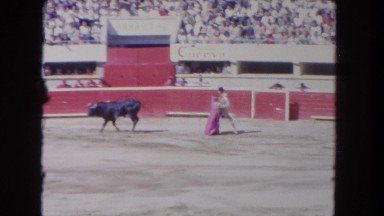 1962: a man is playing with the bull and the red rag SAN PEDRO, CALIFORNIA