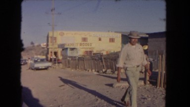 1962: desert sand caged outdoor daylight people watch SAN PEDRO, CALIFORNIA