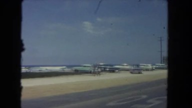 1962: a scene of a drive down a major highway from inside of a fast driving car