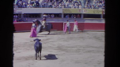 1962: angry bull hitting a horse with a rider in the ground SAN PEDRO