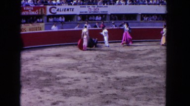 1962: audience provoking a defeated bull after the fight SAN PEDRO, CALIFORNIA