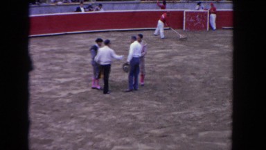 1962: men in the center of a bullfighting ring and a bullfight SAN PEDRO