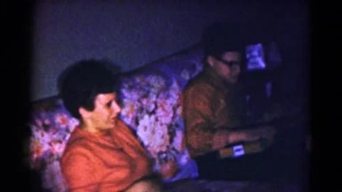 1959: a family sits together on the couch HAGERSTOWN, MARYLAND