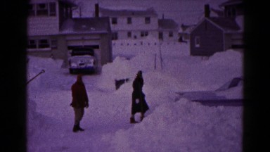 1959: people and snow car and don't work and people are trying to move the car