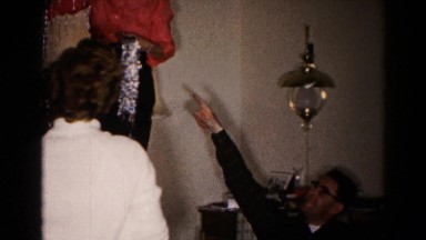 1959: a family putting on the traditional christmas tree together HAGERSTOWN