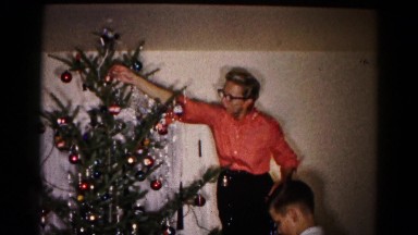 1959: a family is decorating christmas tree HAGERSTOWN, MARYLAND