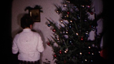 1959: christmas scene mother cheered indoor party presents