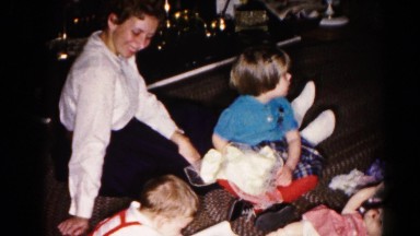 1959: Two Young Kids Play on Living Room Floor Near Cozy Fireplace