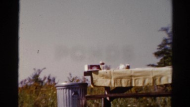 1962: table with cloth and bench arranged in an open place CATSKILL, NEW YORK