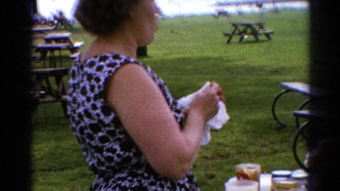 1962: woman wipes her hands during a picnic CATSKILL, NEW YORK