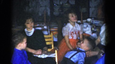 1962: a young boy play shoots another boy with a toy rifle at a party CATSKILL