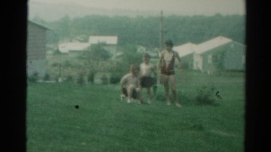 1962: children enjoying and having fun with water in the backyard CATSKILL