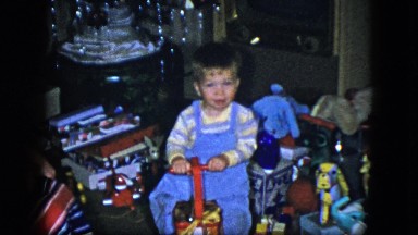 1951: A Blond Toddler Surrounded by Toys and Gifts During a Festive Holiday Season