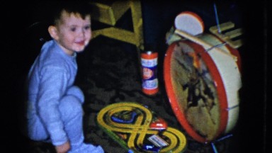 1951: A Little Boy in Pajamas Playing with New Christmas Toys Cleveland Ohio