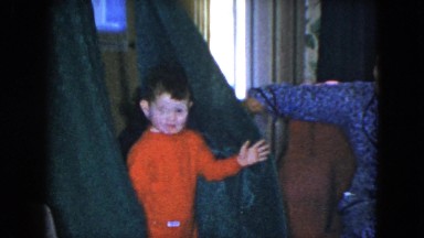 1951: a little boy is playing hide and sick with his mom CLEVELAND, OHIO