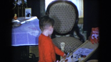 1951: red t shirt sweater wearing indoor child observing CLEVELAND, OHIO