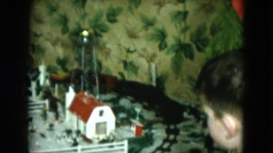 1951: young boy playing with train set CLEVELAND, OHIO