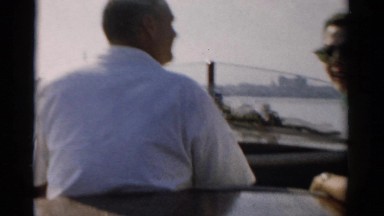 1957: couple boat along shipyard in harbor CATSKILL, NEW YORK