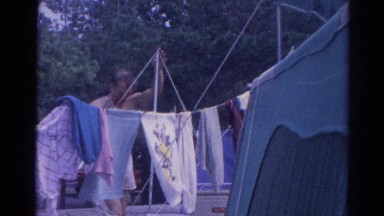 1962: man outdoor clothes talking suit walking garden loving CATSKILL, NEW YORK