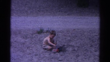 1962: topless kid play desert beach sand build fun CATSKILL, NEW YORK