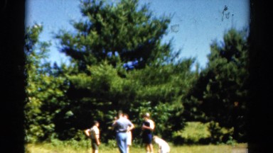1962: people outdoors in a wooded area next to a indian teepee CATSKILL
