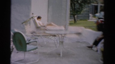 1957: Family Rocking in Swings While Catching Up on the Daily Things of Life