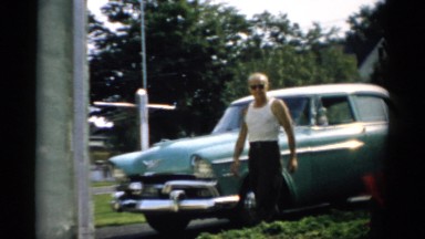 1957: Man Walking Past Car Remove Glass Catskill, New York