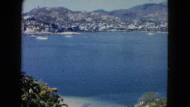 1962: view of an enclosed bay of salt water surrounded by protective hills