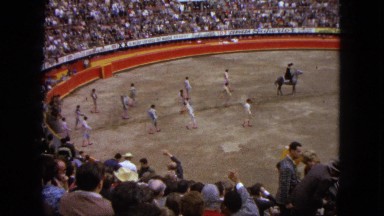 1962: rodeo procession of riders and horses in an arena with onlookers MEXICO