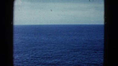 1962: a man looking out over a beautiful jagged beach and coastline MEXICO