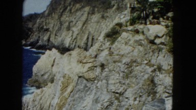 1962: the rock and the sea cristal clean and people around watching