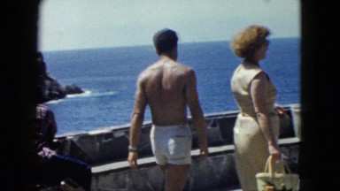 1962: couple poses by seashore MEXICO