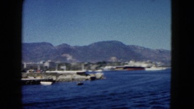 1962: peaceful day at the pier with clear skies and boats MEXICO