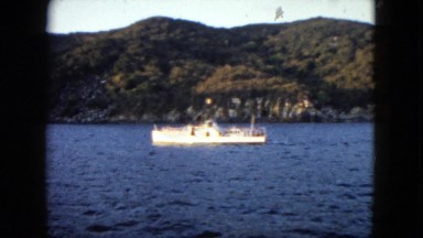 1962: the beautiful boat glides over the calm cool waters MEXICO