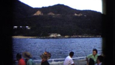 1962: people enjoying the view of the sea and mountains on a boat MEXICO