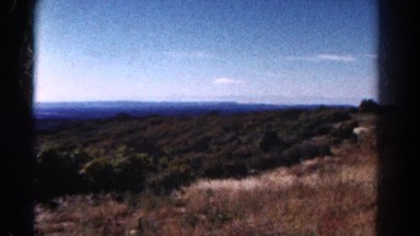 1967: a view of a shallow canyon under a cloudy blue sky COLORADO