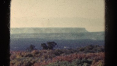 1967: grassland vast area sunlight and mountains water coast COLORADO