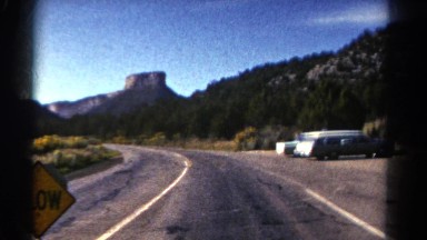 1967: road mountain view greenery hilly signboard COLORADO