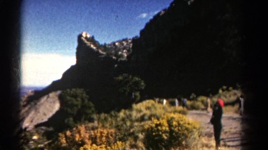 1967: a person is standing on the lap of a huge mountain COLORADO