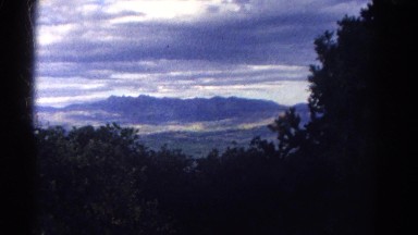 1967: view of a far mountain under dark clouds COLORADO