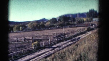 1967: a large ranch or farm in the foothills as seen from a moving vehicle