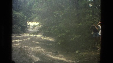 1979: Beautiful Clip of River Flowing Between Trees and Greenery Brazil