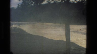 1979: a torrent of water rushes downriver showing the awesome power of nature