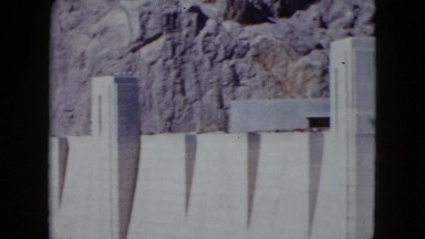 1959: large dam with power supply surrounded by stone canyon ARIZONA