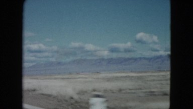 1959: a beautiful mountain ridge as seen through the window of a moving vehicle