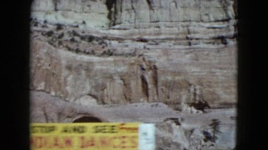 1959: a beautiful rugged mountain ridge as seen thought from a moving vehicle