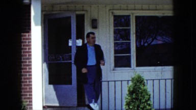 1959: a man in the suit is walking out of the house ARIZONA