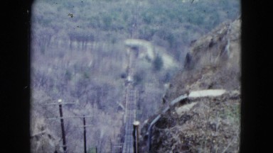 1959: happy fat man in coat and hat coming out and entering a car ARIZONA