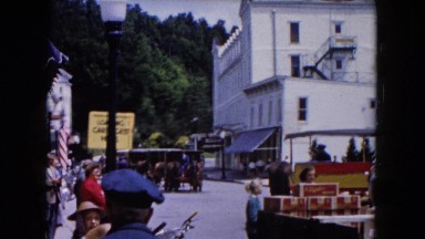 1961: Various People Gather Outdoor on Street Waiting for Parade Michigan